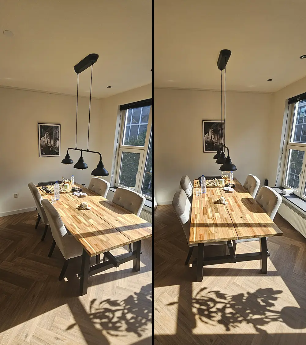 Hanglamp boven een eettafel en kunstwerk aan de wand, beide netjes uitgelijnd